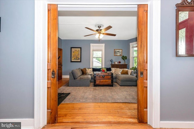 28 N Altamont Ave, Thurmont, MD 21788 - living area featuring wood finished floors, a ceiling fan, and baseboards