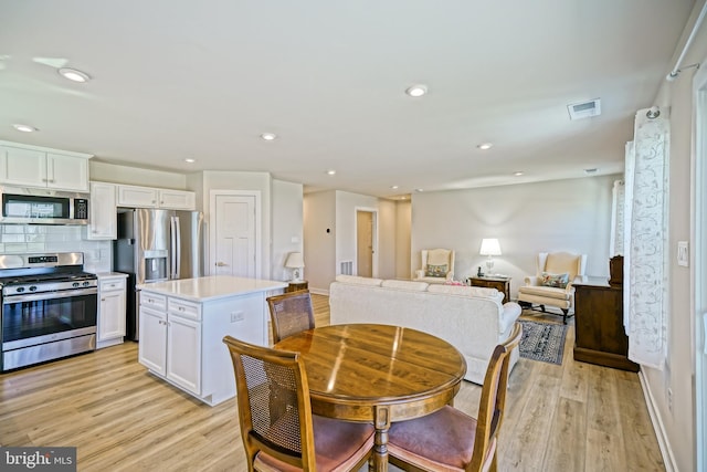 25083 Aspen Cir, Millsboro, DE 19966 - dining space featuring light wood finished floors and recessed lighting