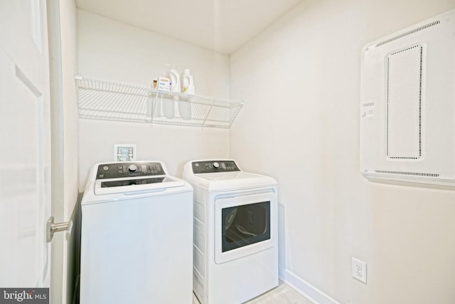 25083 Aspen Cir, Millsboro, DE 19966 - washroom with washing machine and dryer and baseboards