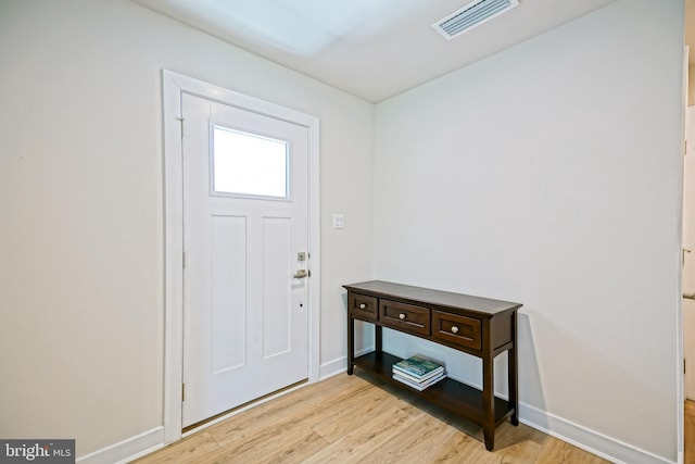 25083 Aspen Cir, Millsboro, DE 19966 - foyer entrance with light wood-style flooring and baseboards