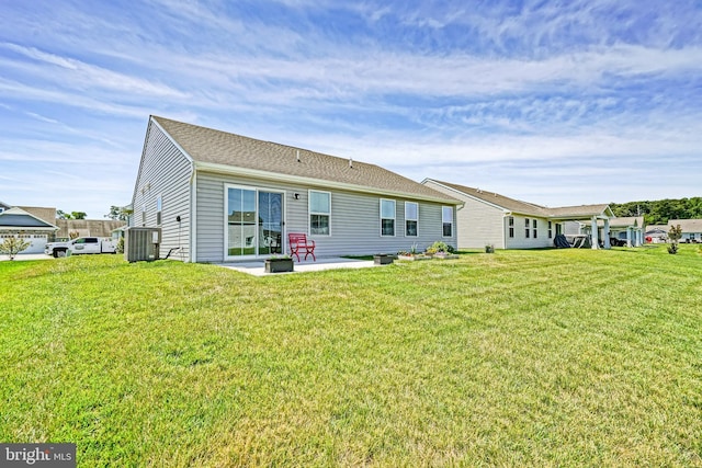 25083 Aspen Cir, Millsboro, DE 19966 - rear view of property with central air condition unit, a yard, and a patio area