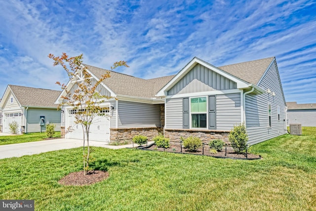 25083 Aspen Cir, Millsboro, DE 19966 - view of front of house featuring board and batten siding, driveway, a garage, stone siding, and a front yard