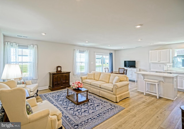 25083 Aspen Cir, Millsboro, DE 19966 - living room featuring light wood-type flooring and recessed lighting