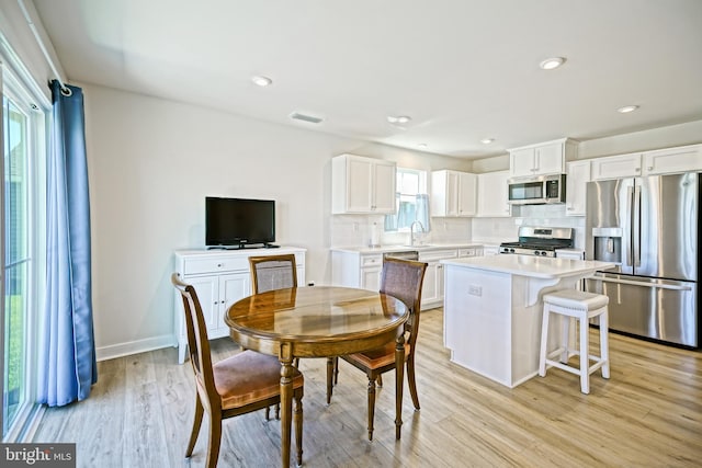 25083 Aspen Cir, Millsboro, DE 19966 - dining room featuring light wood-style floors, recessed lighting, and baseboards