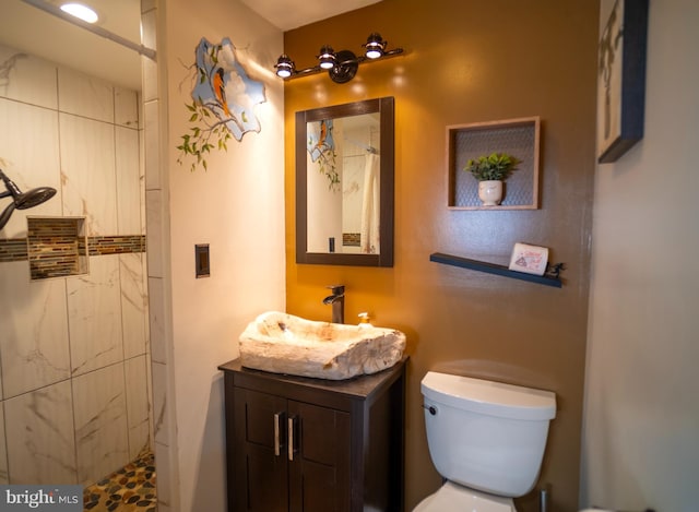 1211 Birch Ave, Baltimore, MD 21227 - bathroom with vanity, tiled shower, and toilet