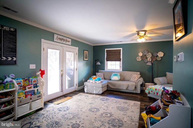 1211 Birch Ave, Baltimore, MD 21227 - living room featuring french doors, ornamental molding, wood finished floors, and a ceiling fan