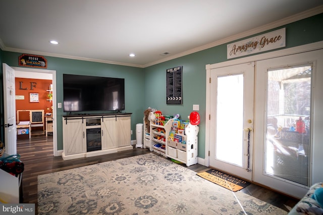 1211 Birch Ave, Baltimore, MD 21227 - game room featuring crown molding, dark wood-style floors, plenty of natural light, recessed lighting, and french doors