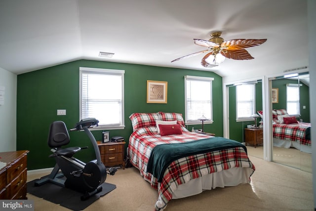 1211 Birch Ave, Baltimore, MD 21227 - bedroom featuring vaulted ceiling, light colored carpet, multiple windows, and two closets