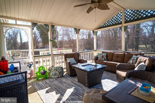 1211 Birch Ave, Baltimore, MD 21227 - wooden terrace with an outdoor living space with a fire pit, ceiling fan, and view of wooded area