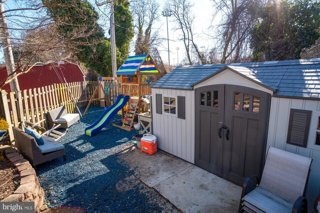 1211 Birch Ave, Baltimore, MD 21227 - view of shed with a playground