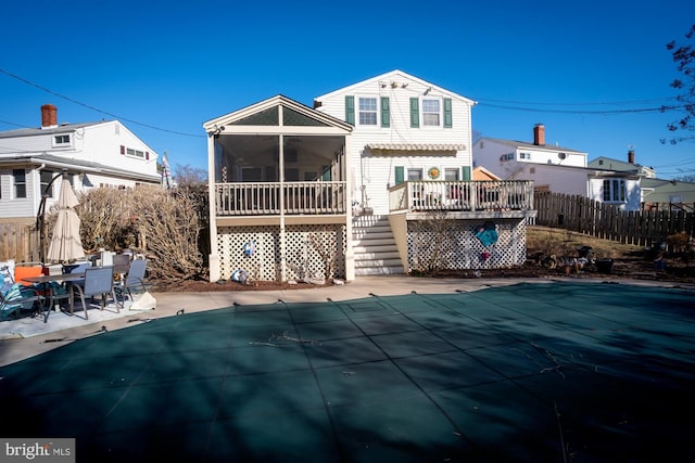 1211 Birch Ave, Baltimore, MD 21227 - back of property featuring a sunroom, a deck, stairway, and a patio area