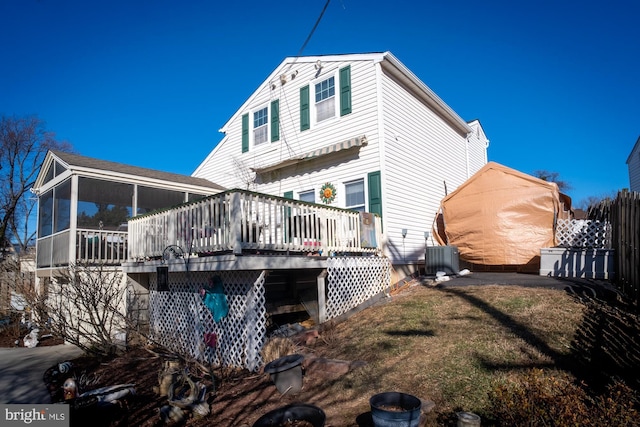 1211 Birch Ave, Baltimore, MD 21227 - rear view of house featuring a sunroom, a wooden deck, a yard, and central air condition unit
