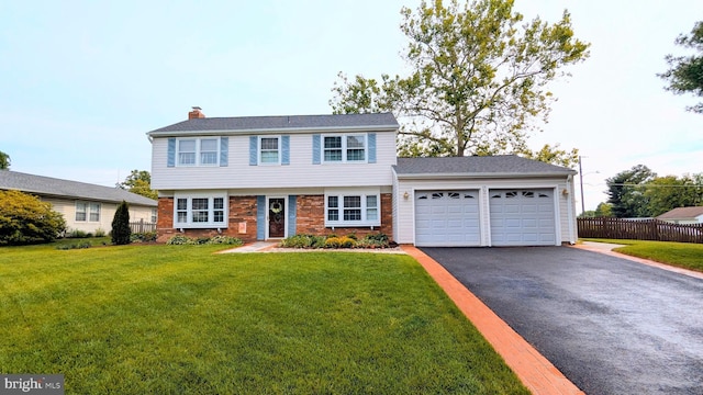 13129 Pennerview Ln, Fairfax, VA 22033 - colonial-style house with an attached garage, driveway, a chimney, and brick siding