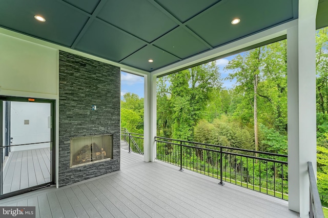 1434 Waggaman Cir, Mclean, VA 22101 - wooden terrace with an outdoor stone fireplace