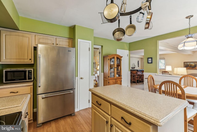 5 S Syracuse Dr, Cherry Hill, NJ 08034 - kitchen with appliances with stainless steel finishes, light wood-style flooring, light countertops, pendant lighting, and a kitchen island