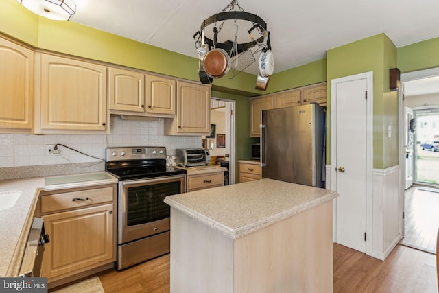 5 S Syracuse Dr, Cherry Hill, NJ 08034 - kitchen featuring appliances with stainless steel finishes, light brown cabinets, light countertops, light wood finished floors, and backsplash