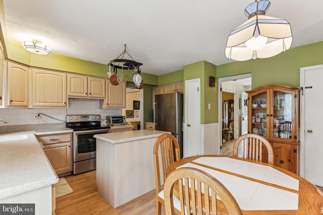 5 S Syracuse Dr, Cherry Hill, NJ 08034 - kitchen featuring stainless steel appliances, a sink, light countertops, light wood-type flooring, and light brown cabinets
