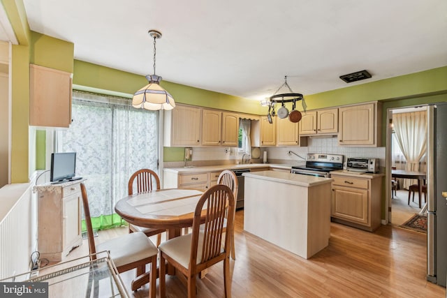 5 S Syracuse Dr, Cherry Hill, NJ 08034 - kitchen featuring appliances with stainless steel finishes, light brown cabinetry, light countertops, and light wood-style floors