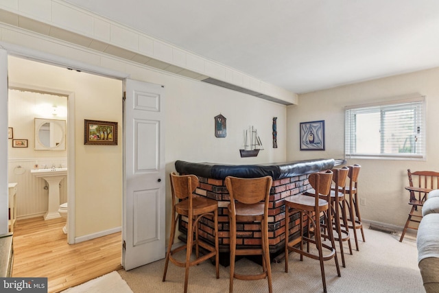 5 S Syracuse Dr, Cherry Hill, NJ 08034 - dining space with a dry bar, light wood-type flooring, and baseboards