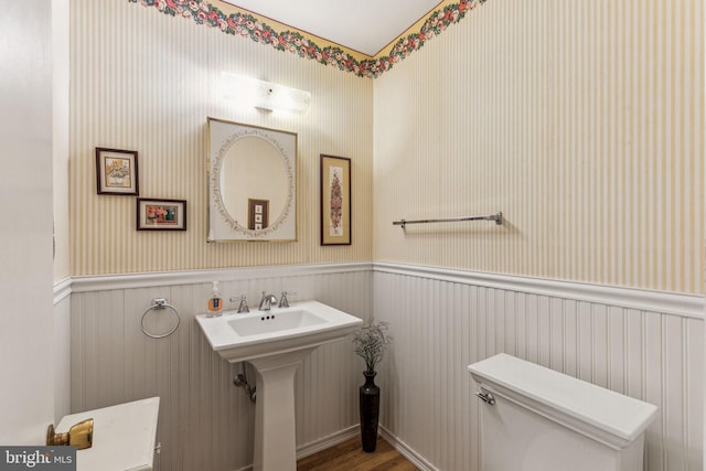5 S Syracuse Dr, Cherry Hill, NJ 08034 - half bathroom featuring toilet, a wainscoted wall, and wood finished floors
