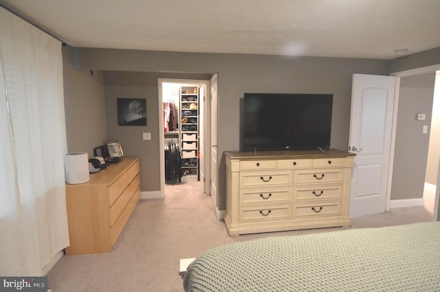 507 Fuselage Ave, Baltimore, MD 21221 - bedroom featuring a spacious closet, light carpet, and a closet