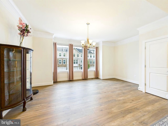 4737 Earl Flanagan Way, Alexandria, VA 22309 - unfurnished dining area featuring a chandelier, light wood-type flooring, crown molding, and baseboards