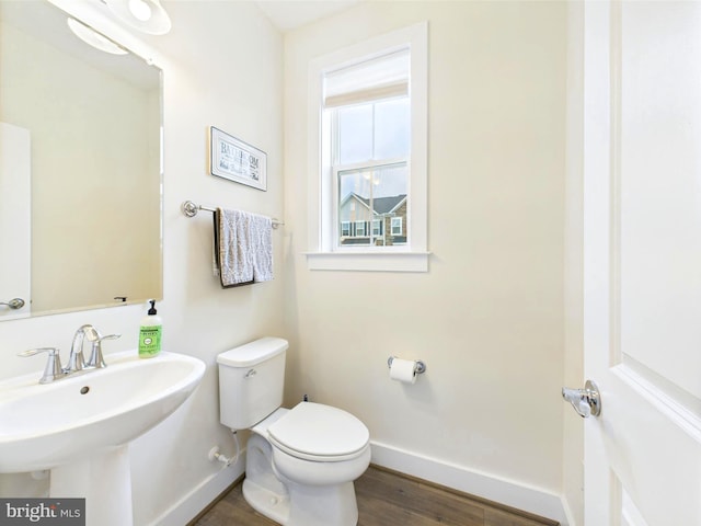 4737 Earl Flanagan Way, Alexandria, VA 22309 - bathroom featuring baseboards, toilet, wood finished floors, and a sink