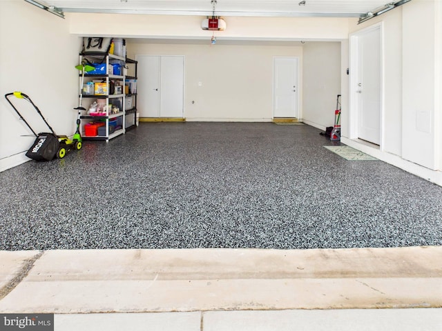 4737 Earl Flanagan Way, Alexandria, VA 22309 - garage featuring a garage door opener and baseboards