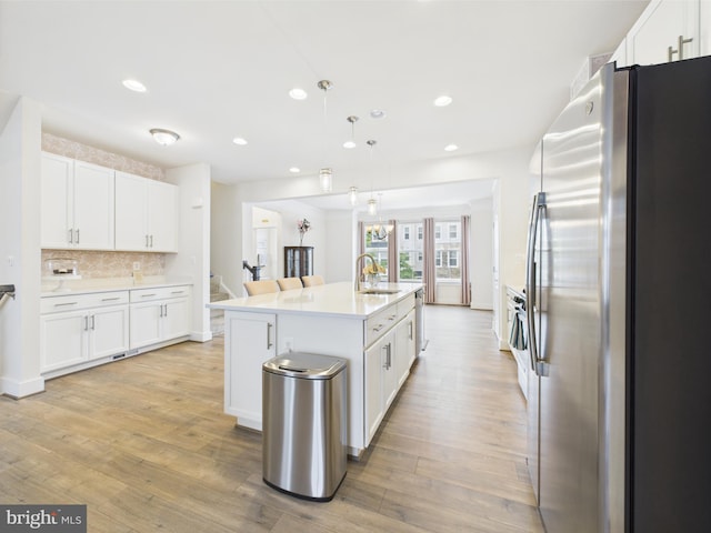 4737 Earl Flanagan Way, Alexandria, VA 22309 - kitchen with stainless steel refrigerator with ice dispenser, a sink, recessed lighting, white cabinetry, and tasteful backsplash