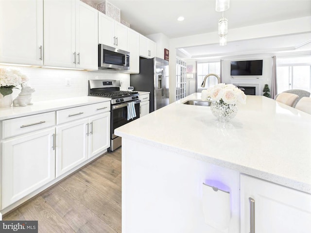 4737 Earl Flanagan Way, Alexandria, VA 22309 - kitchen with appliances with stainless steel finishes, a sink, white cabinetry, plenty of natural light, and recessed lighting