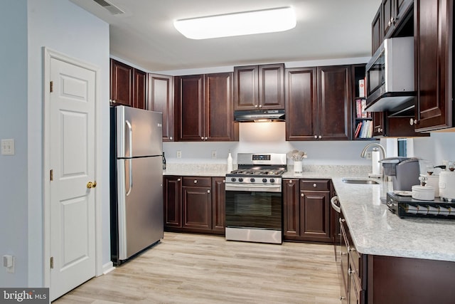 8859 Howland Pl, Bristow, VA 20136 - kitchen featuring stainless steel appliances, under cabinet range hood, and dark brown cabinets