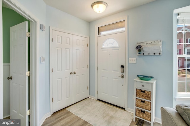 8859 Howland Pl, Bristow, VA 20136 - foyer entrance featuring light wood-style flooring and baseboards