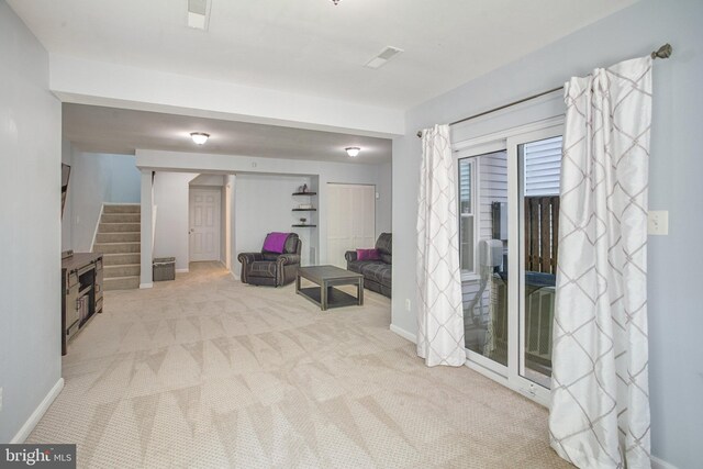 8859 Howland Pl, Bristow, VA 20136 - sitting room featuring stairs and carpet floors