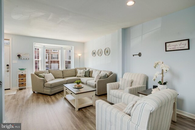 8859 Howland Pl, Bristow, VA 20136 - living area with wood finished floors and recessed lighting