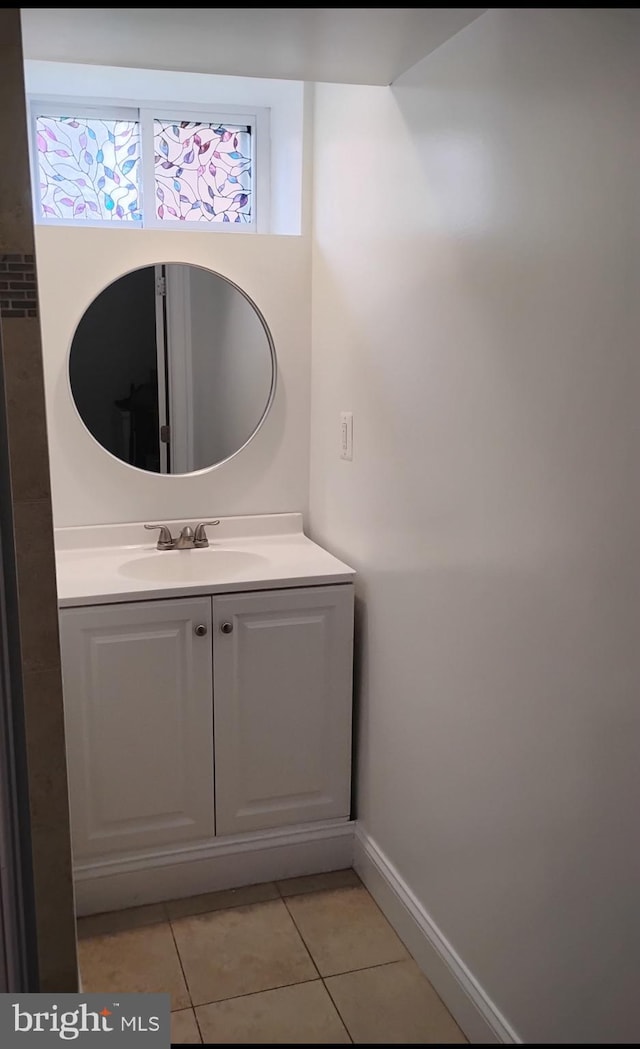 5709 Walther Ave, Baltimore, MD 21206 - bathroom with tile patterned floors, vanity, and baseboards