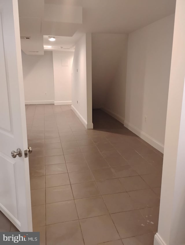 5709 Walther Ave, Baltimore, MD 21206 - finished below grade area with tile patterned flooring and baseboards