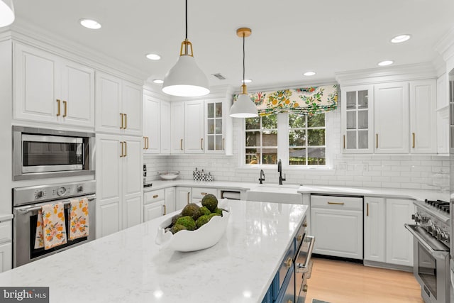 725 Cornerstone Ln, Bryn Mawr, PA 19010 - kitchen featuring stainless steel appliances, a sink, white cabinets, decorative light fixtures, and recessed lighting