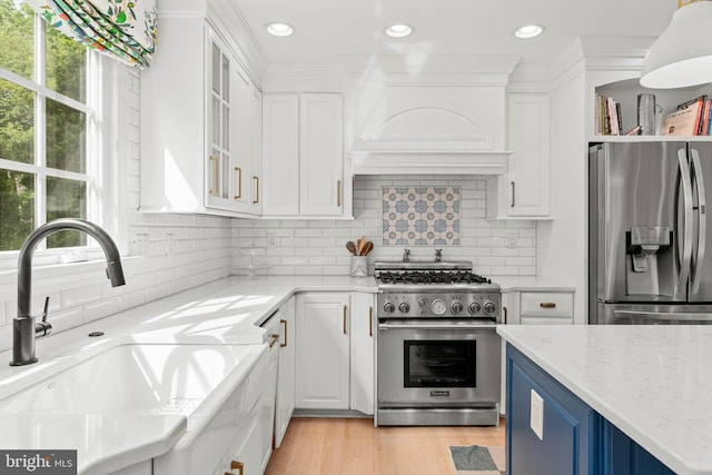 725 Cornerstone Ln, Bryn Mawr, PA 19010 - kitchen with appliances with stainless steel finishes, a sink, white cabinets, plenty of natural light, and recessed lighting