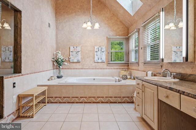 725 Cornerstone Ln, Bryn Mawr, PA 19010 - bathroom featuring a chandelier, vanity, a skylight, a bath, and tile patterned flooring