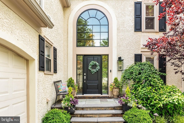 725 Cornerstone Ln, Bryn Mawr, PA 19010 - property entrance featuring stucco siding and a garage