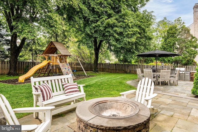 725 Cornerstone Ln, Bryn Mawr, PA 19010 - view of patio featuring a fire pit, a playground, and outdoor dining space