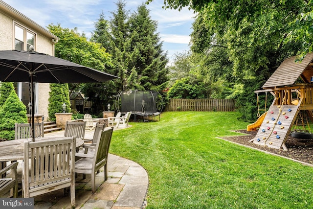 725 Cornerstone Ln, Bryn Mawr, PA 19010 - view of yard with a trampoline, a playground, outdoor dining area, and a patio