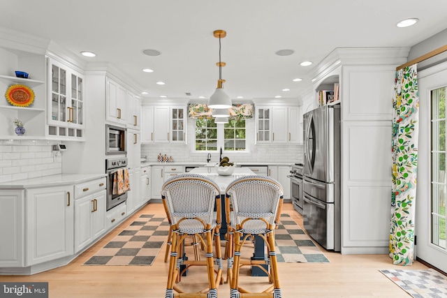 725 Cornerstone Ln, Bryn Mawr, PA 19010 - kitchen with stainless steel appliances, open shelves, white cabinetry, backsplash, and recessed lighting