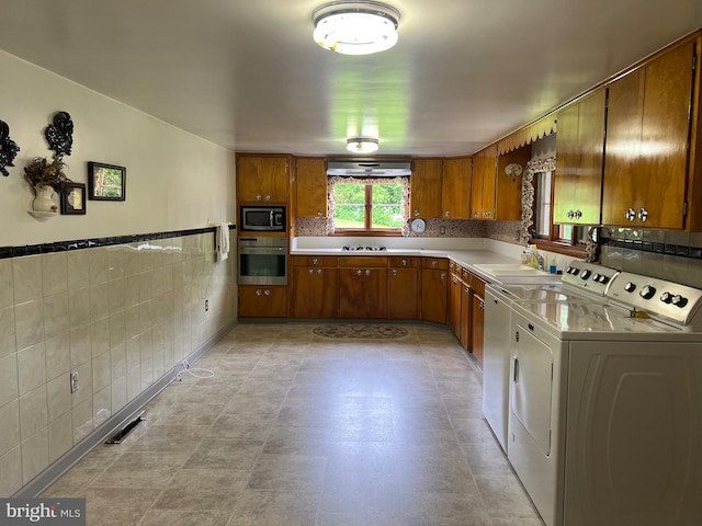 3600 Oak Ave, Altoona, PA 16601 - kitchen with stainless steel appliances, independent washer and dryer, brown cabinets, light countertops, and tile walls