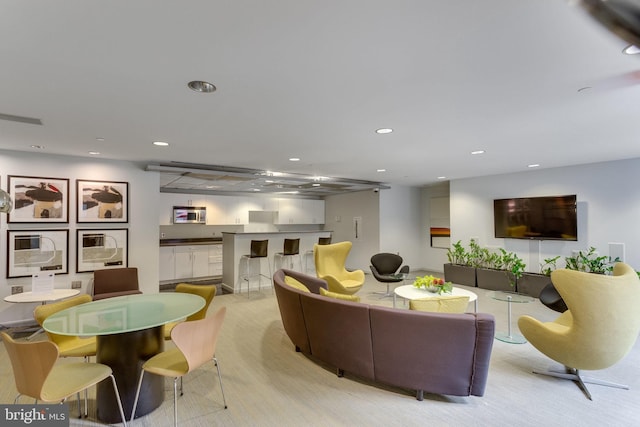 1300 N St NW Unit 817, Washington, DC 20005 - living room featuring recessed lighting and a community bar