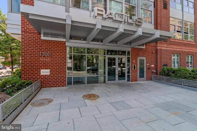 1300 N St NW Unit 817, Washington, DC 20005 - doorway to property with brick siding and a patio