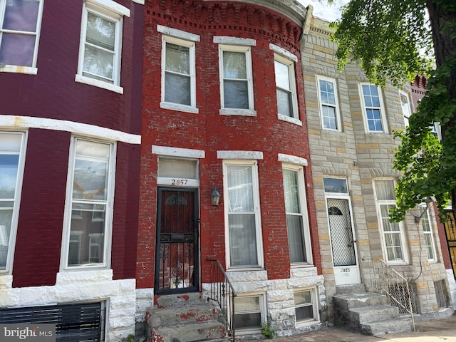 2857 Woodbrook Ave, Baltimore, MD 21217 - townhome / multi-family property featuring entry steps and stone siding