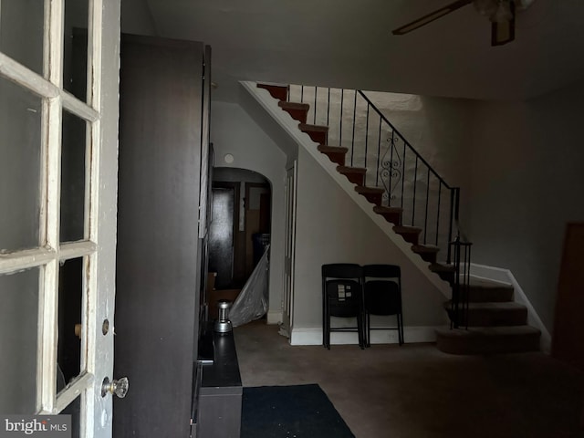 2857 Woodbrook Ave, Baltimore, MD 21217 - entrance foyer with arched walkways, a ceiling fan, stairway, and baseboards