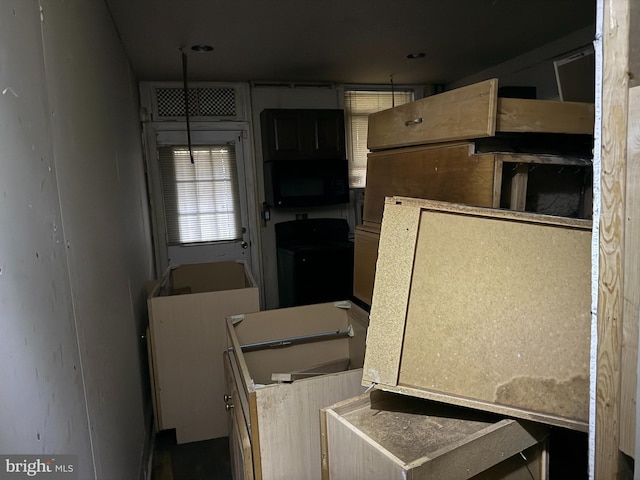 2857 Woodbrook Ave, Baltimore, MD 21217 - kitchen with washer / clothes dryer and black microwave