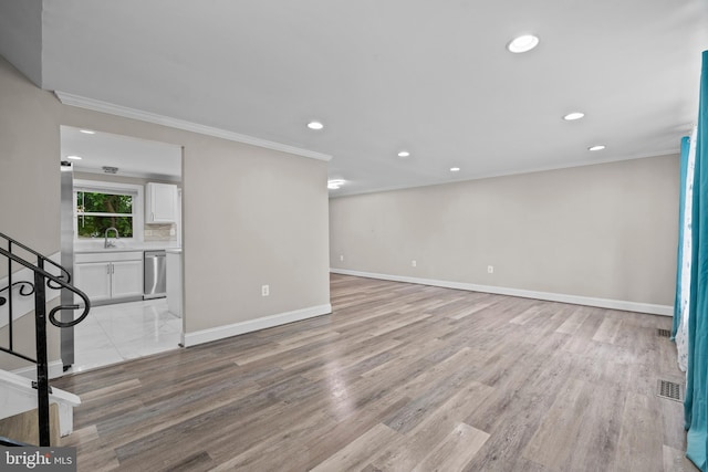 5908 Michael Rd, Waldorf, MD 20601 - empty room with ornamental molding, recessed lighting, baseboards, light wood-style flooring, and stairs